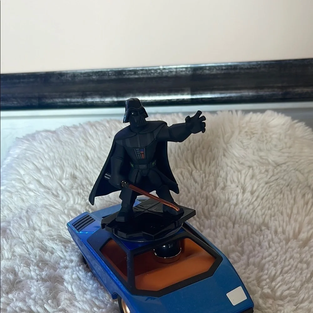 Darth Vader Figure on Blue Car